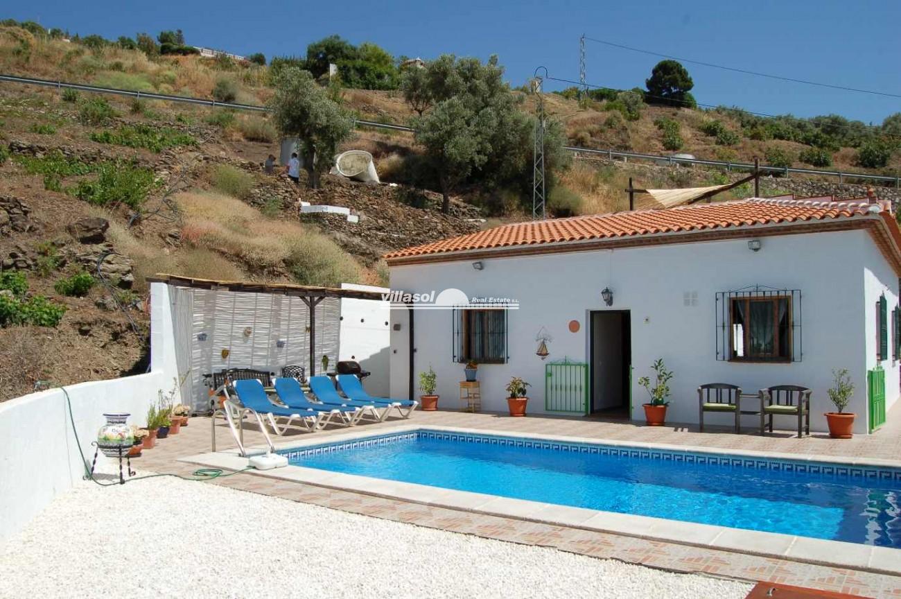 excellent country property is situated just 15 minutes drive from the coast with no track and just 100 metres from the main Torrox / Competa road,